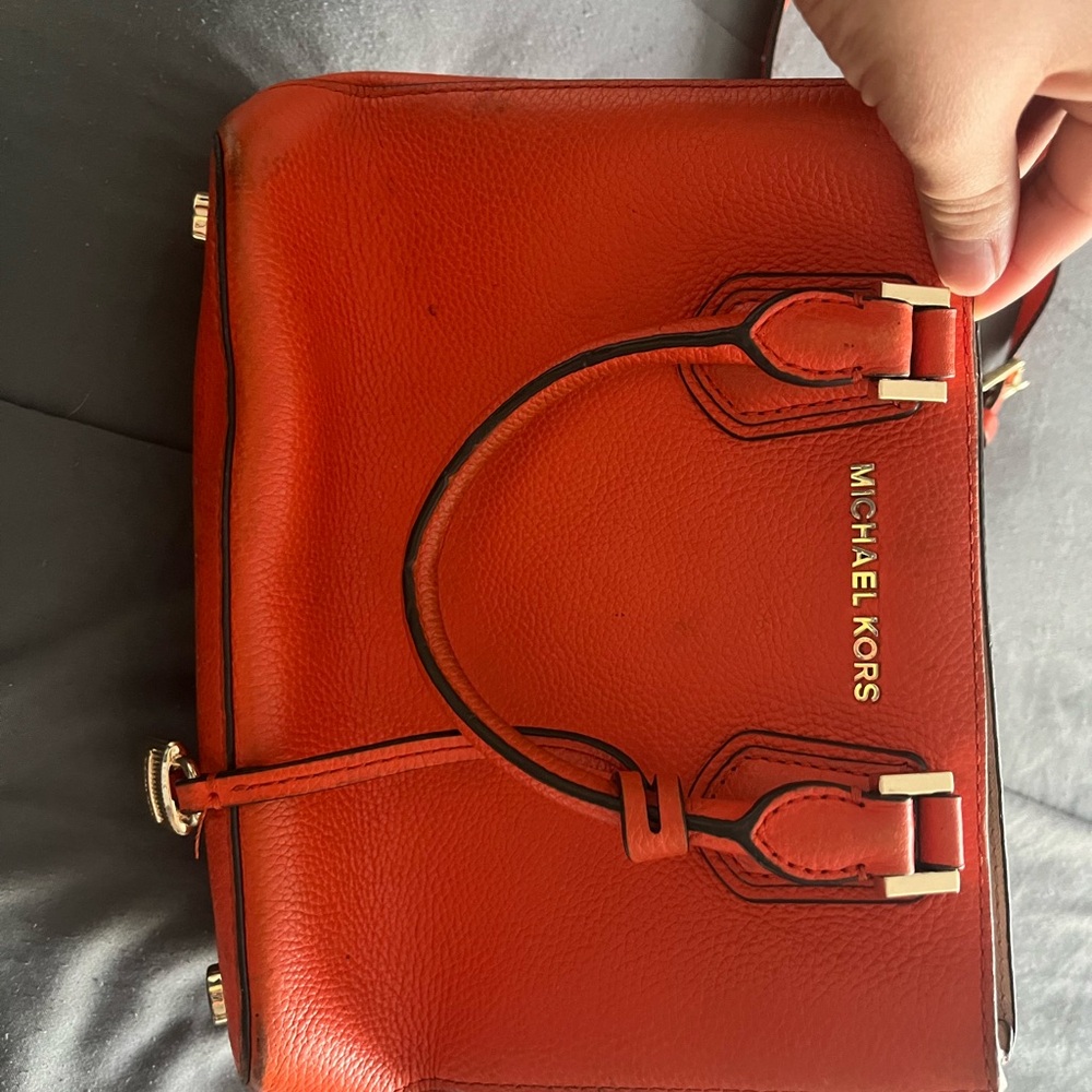 Original Micheal kors mini hand bag with belt.
